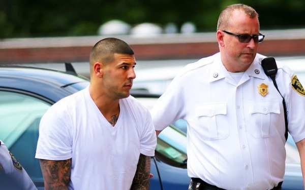 Aaron Hernandez is currently awaiting trial for the murder of Odin Lloyd.  (Getty Images)